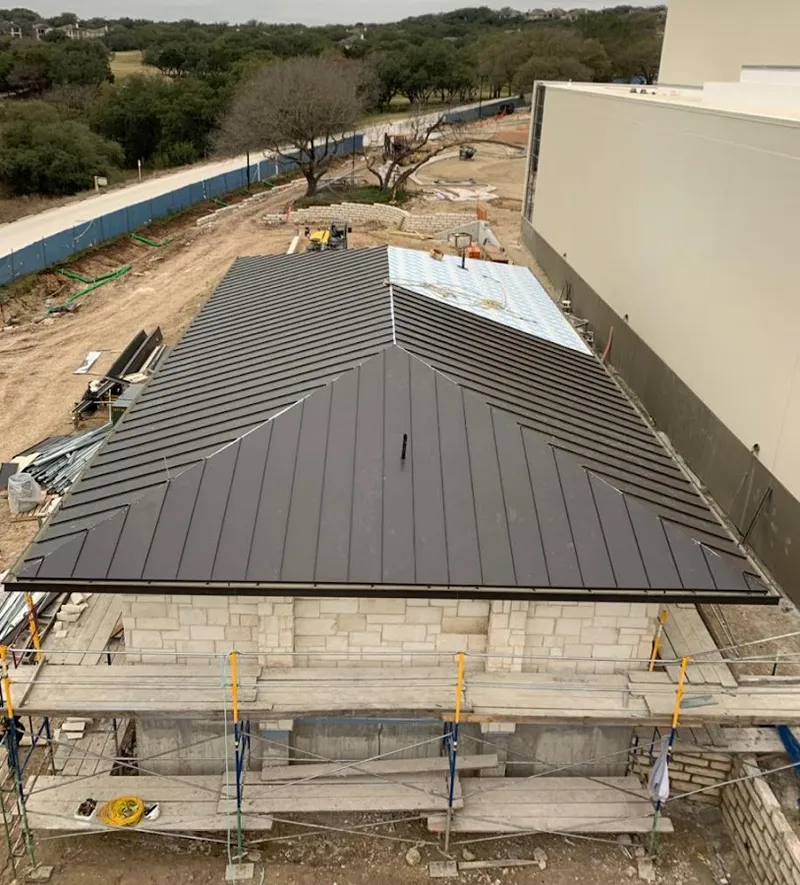 Metal roof new construction with scaffolding in Cumberland